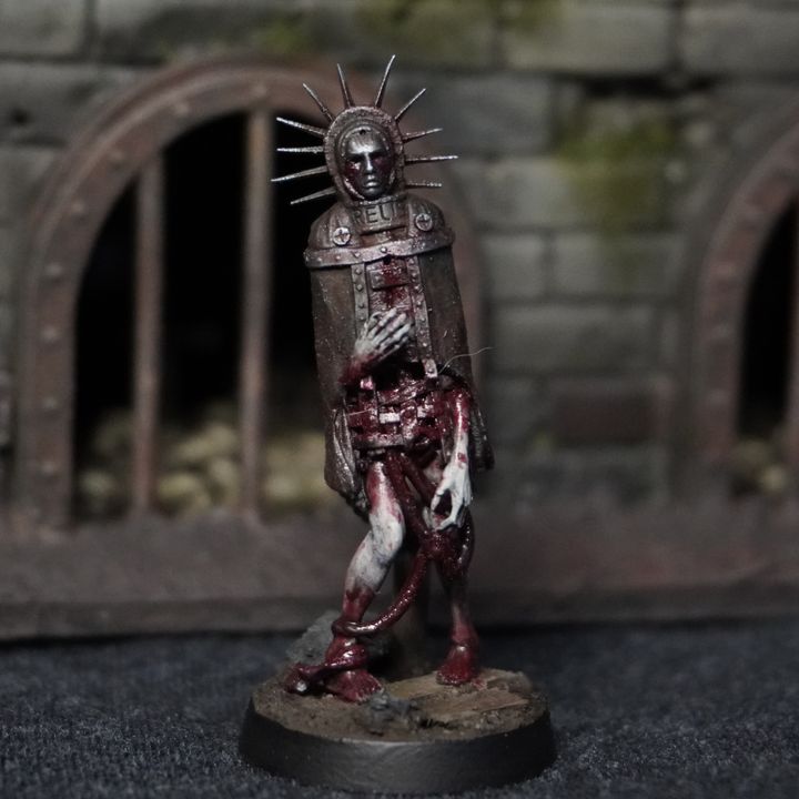 Iron Maiden by Realsteone Miniatures, is a proxy for Ecclesiastic Prisoner, in Trench Pilgrims.